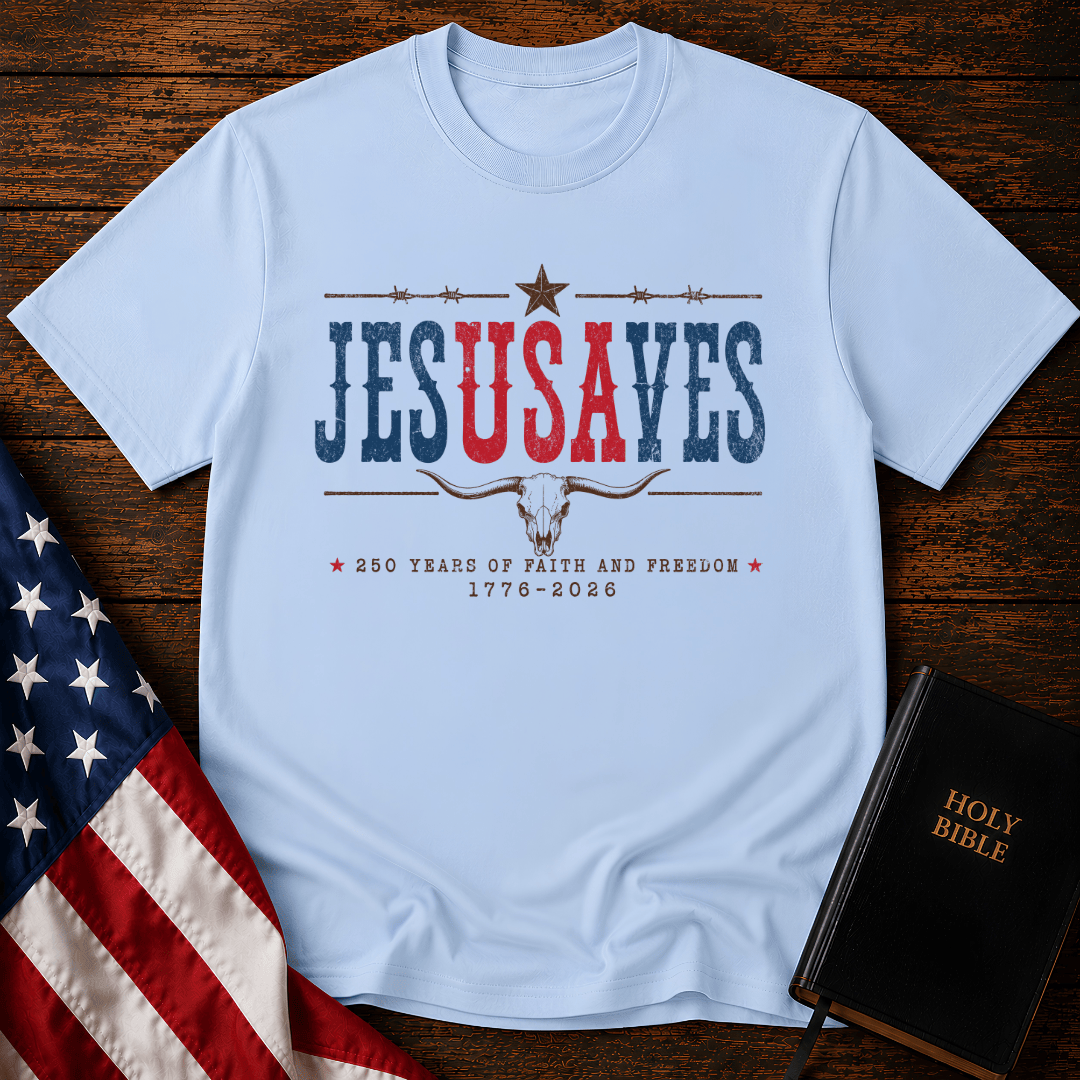 Patriotic sand colored graphic t shirt with Jesus Saves text, a longhorn skull, barbed wire, and American flag.