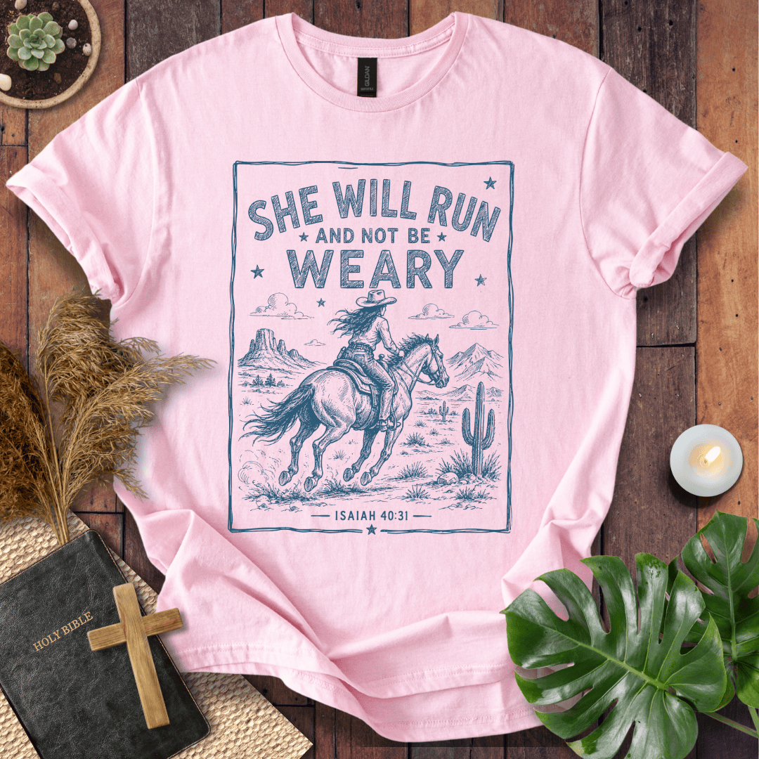 graphic tee with a blue sketch of a cowgirl riding a horse in the desert under Isaiah forty thirty-one text.