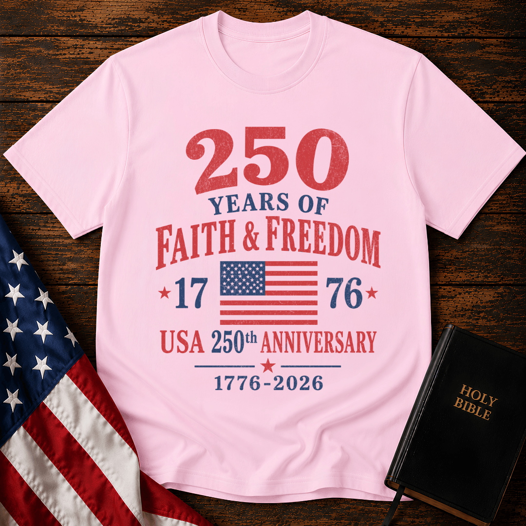 Patriotic t-shirt reading 250 Years of Faith and Freedom 1776 to 2026 with an American flag on a wood 