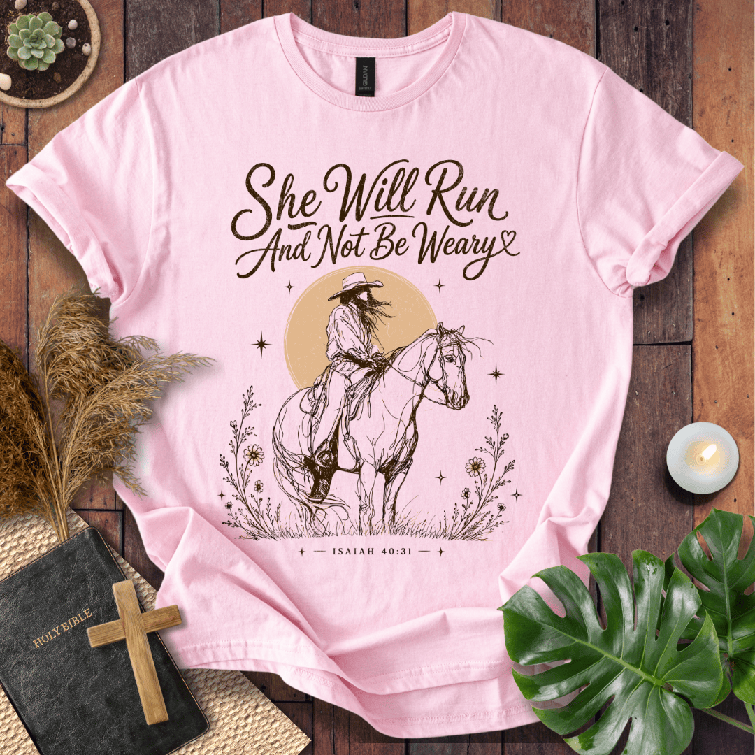 A vintage cream t-shirt featuring a sketched cowgirl on a horse under a desert sun with Isaiah 40:31.