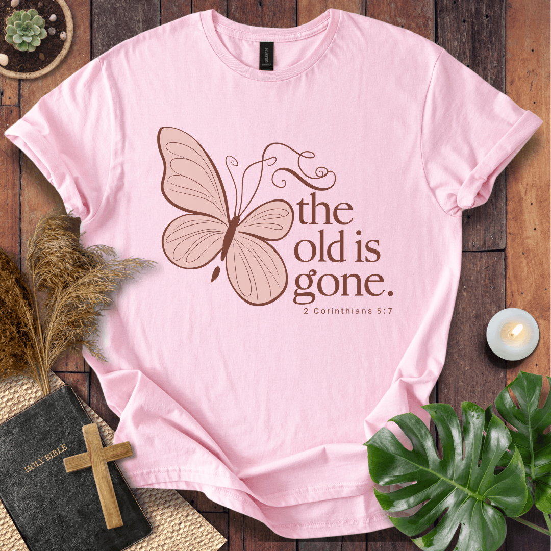 t-shirt with a dusty rose butterfly and "the old is gone" 2 Corinthians 5:17 text in brown ink.