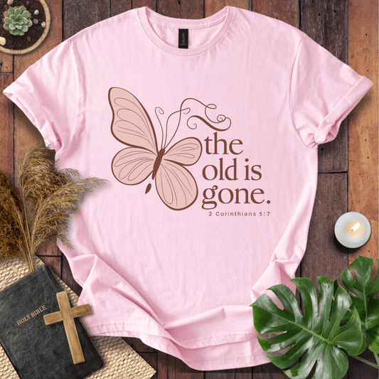 t-shirt with a dusty rose butterfly and "the old is gone" 2 Corinthians 5:17 text in brown ink.