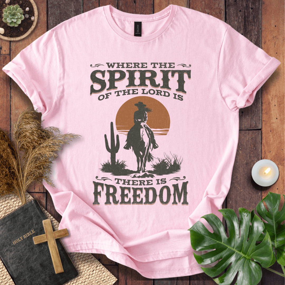 A Western tee featuring a horse rider, cactus, and sunset with the bible verse 2 Corinthians 3:17.