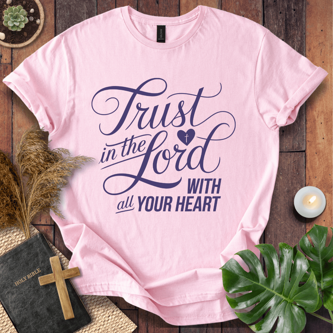 Proverbs 3:5 Trust in the Lord script design on a Christian t shirt for women styled with a bible and cross.