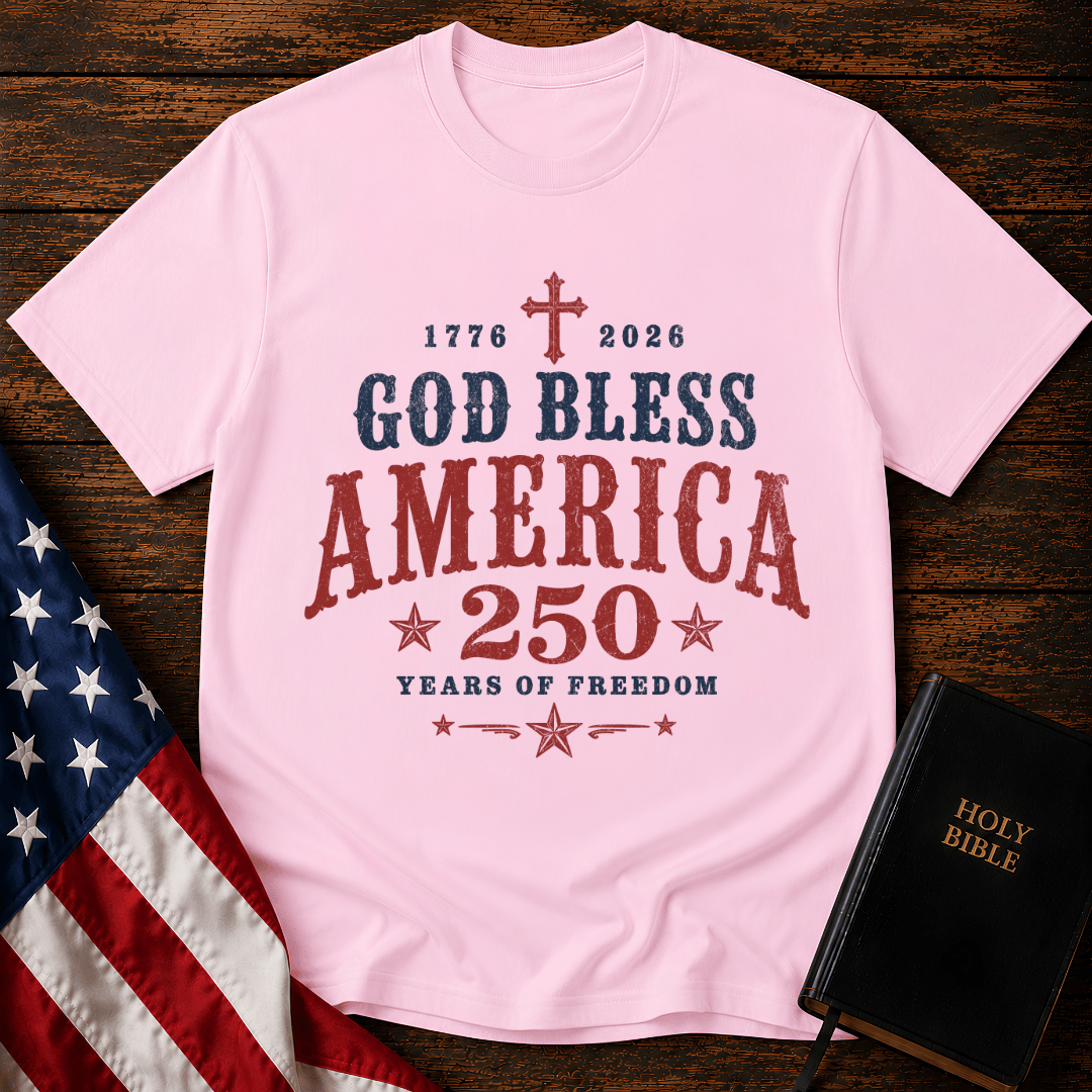 God Bless America 250 Years of Freedom t-shirt next to a Holy Bible and US flag