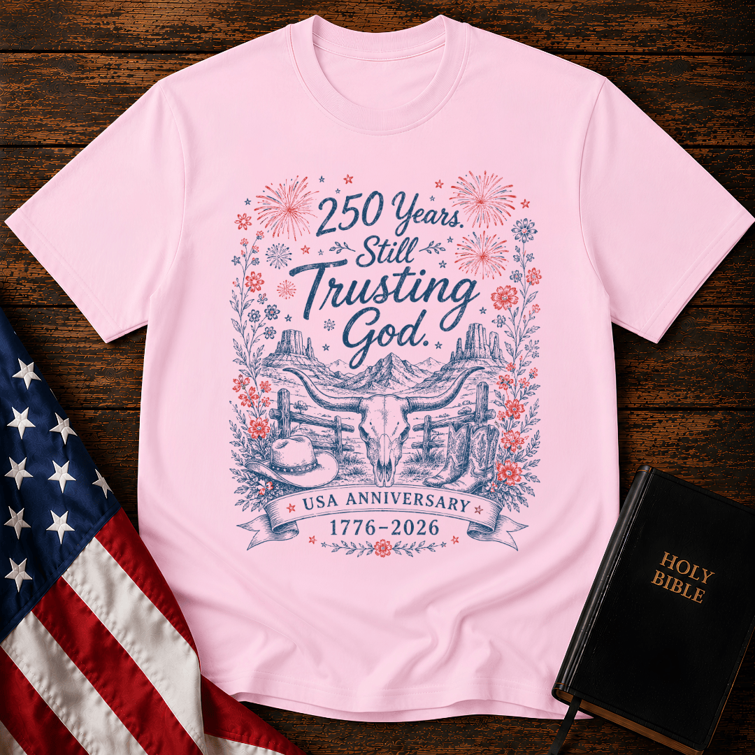 patriotic western graphic tee featuring a longhorn skull, cowboy boots, fireworks, and 1776-2026 text.