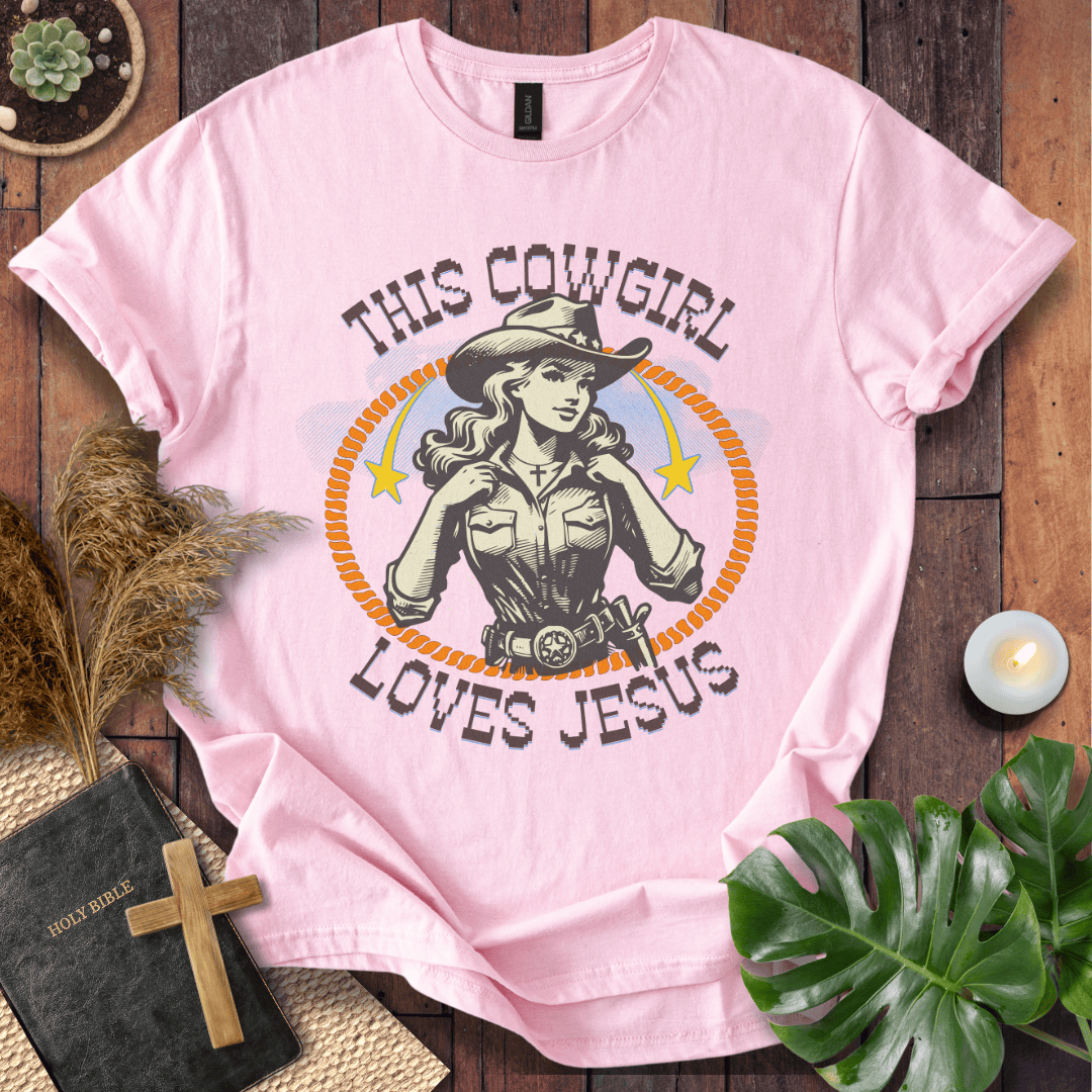 Christian t-shirt featuring a vintage cowgirl illustration with a lasso and the text This Cowgirl Loves Jesus.