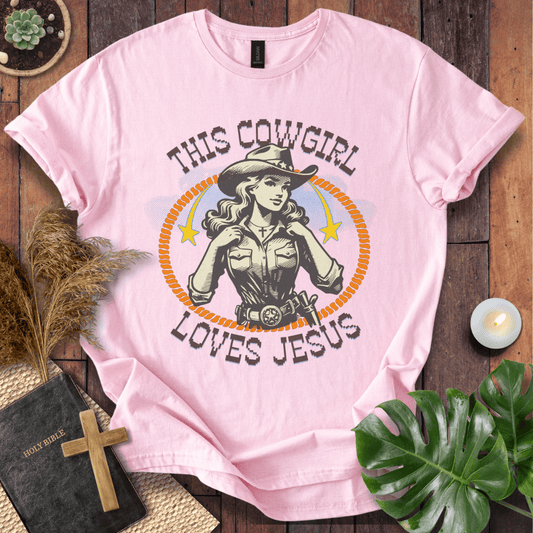 Christian t-shirt featuring a vintage cowgirl illustration with a lasso and the text This Cowgirl Loves Jesus.