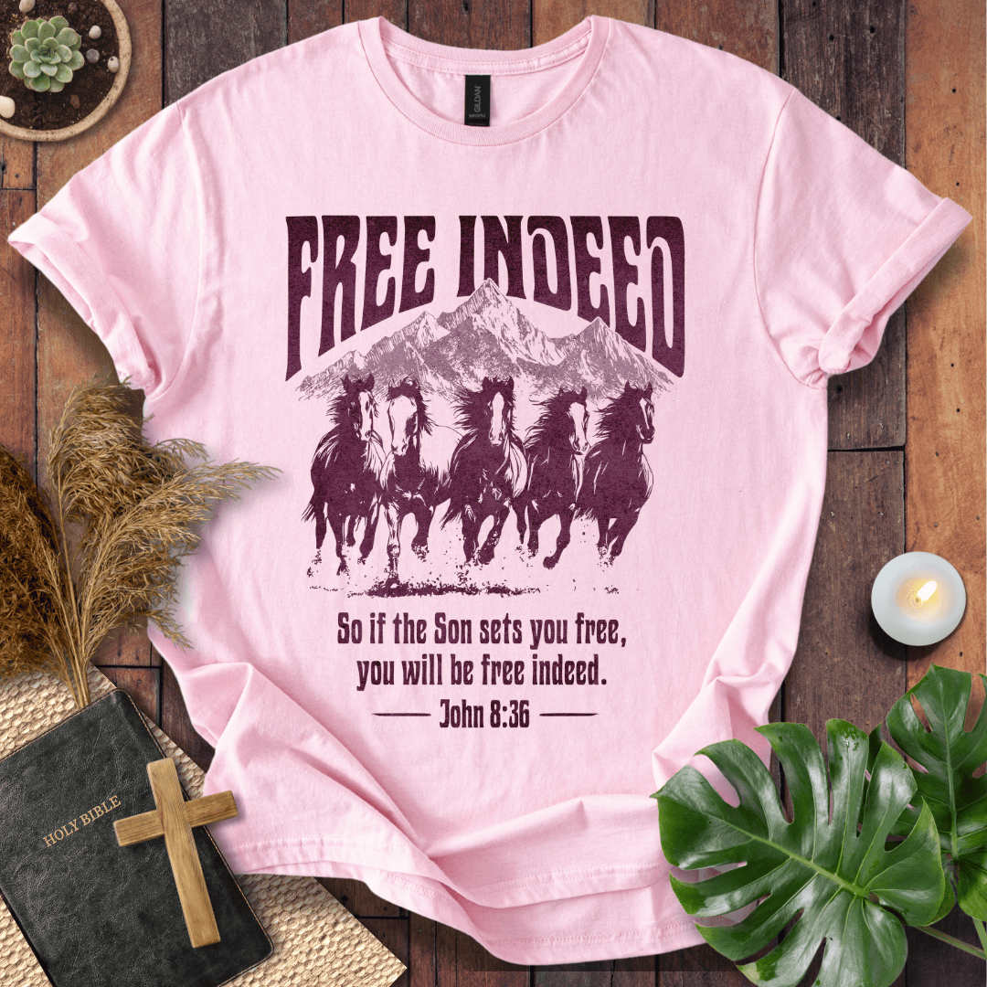 t-shirt featuring five wild horses, mountains, and John 8:36 "Free Indeed" in a vintage distressed print.
