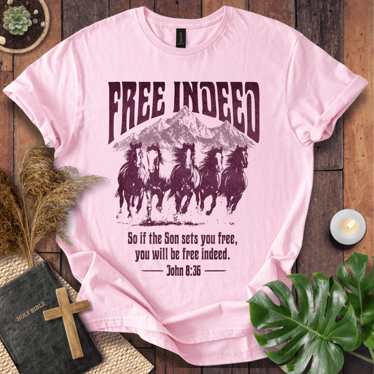 t-shirt featuring five wild horses, mountains, and John 8:36 "Free Indeed" in a vintage distressed print.