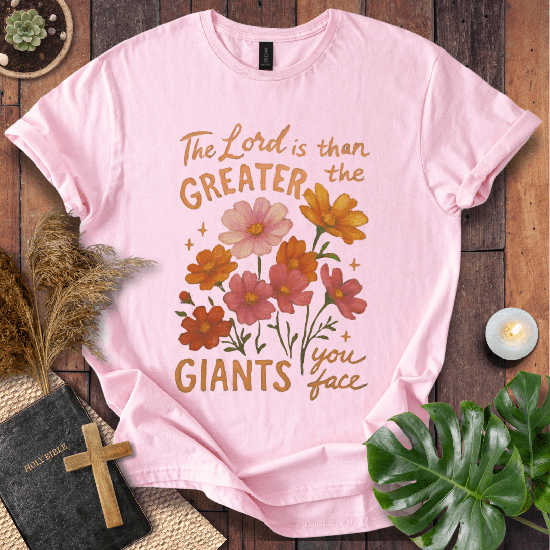 “The Lord is greater than the giants you face” floral lettering Christian t-shirt; uplifting faith tee.