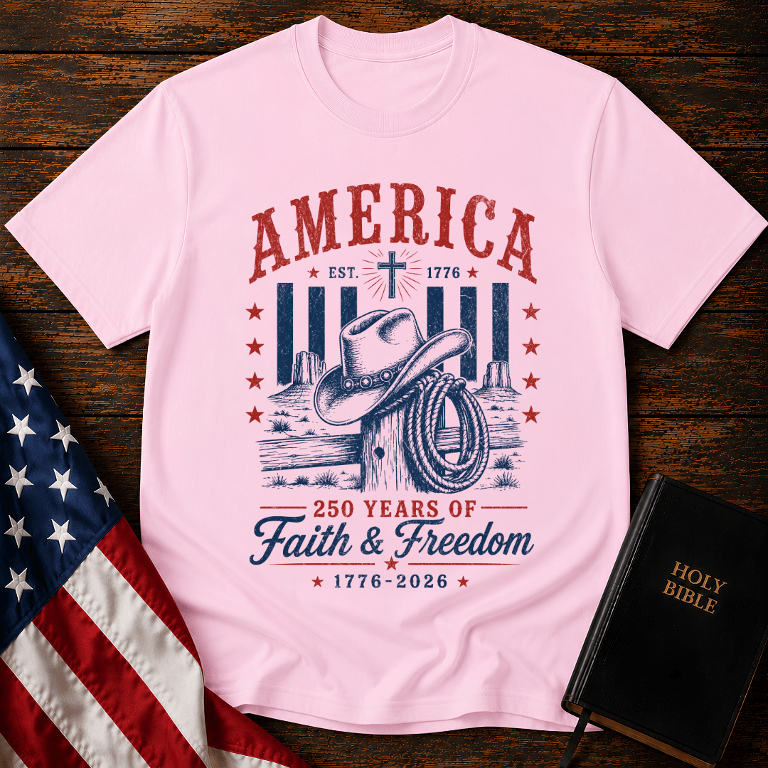 Patriotic Western graphic tee named featuring a cowboy hat, lasso, cross, and "250 Years of Faith & Freedom".
