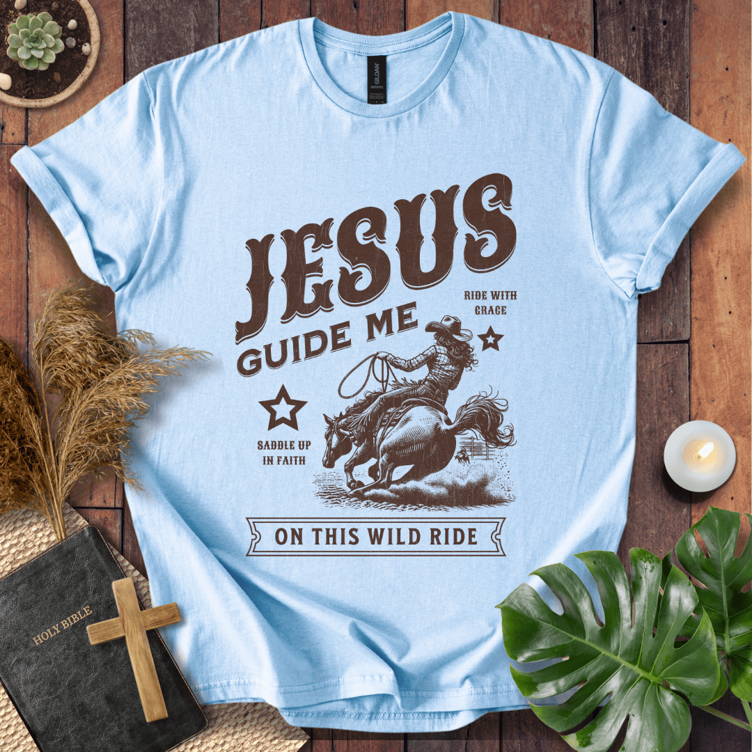 Vintage style t-shirt with a cowgirl riding a horse and text reading Jesus Guide Me On This Wild Ride.