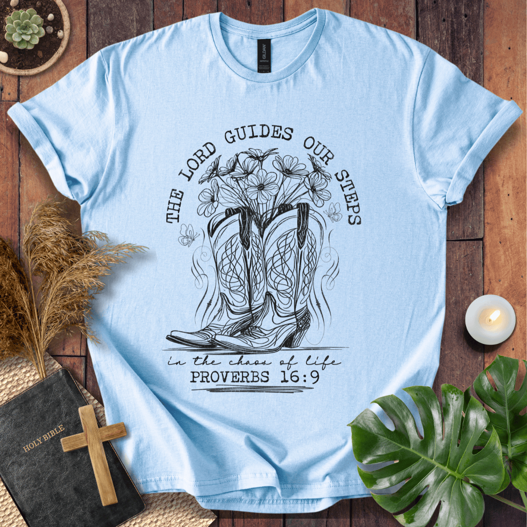 Western cowboy boots with wildflowers and butterflies on shirt with Proverbs 16:9 Bible verse text.