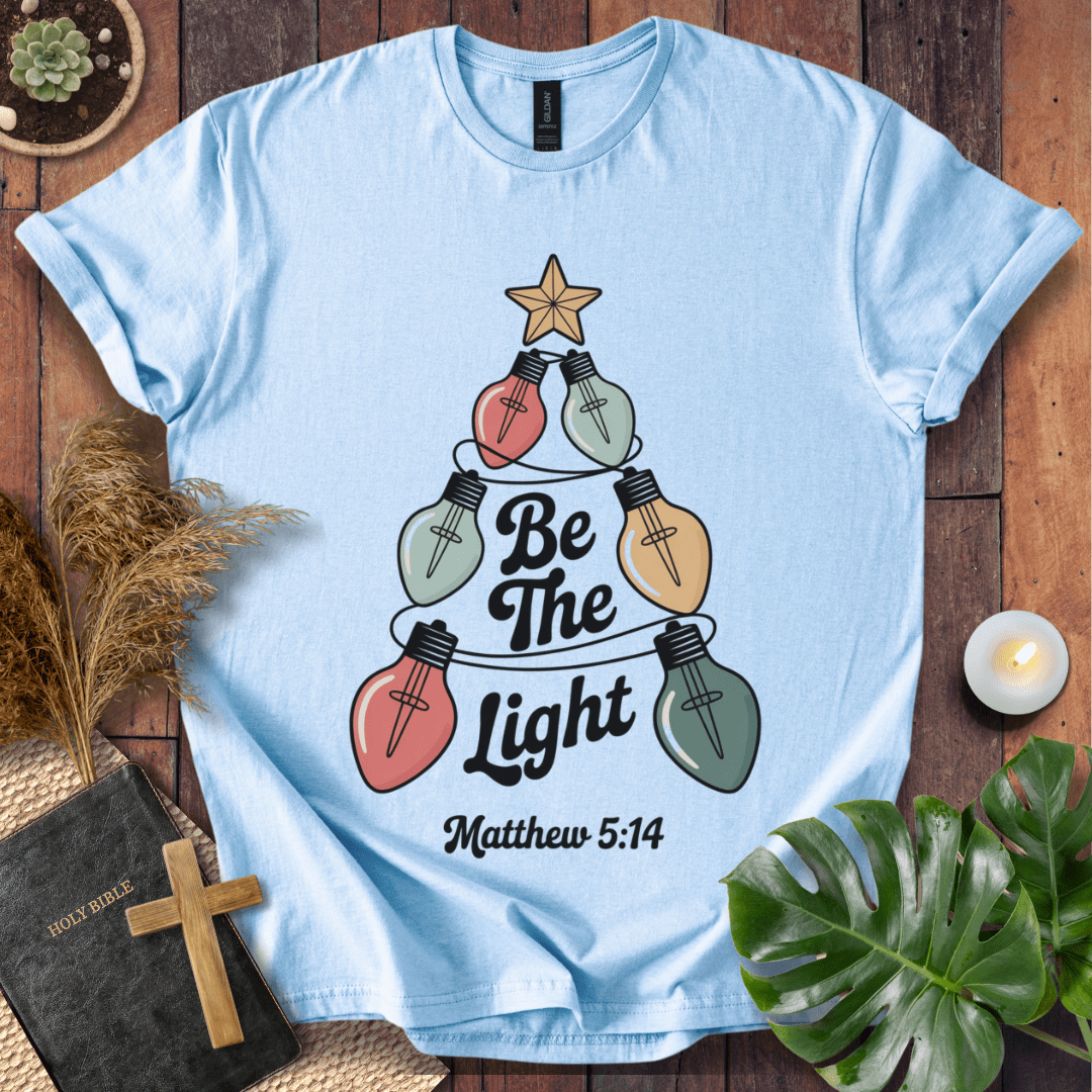 Faith Christmas shirt encouraging believers to shine their light – religious holiday tee