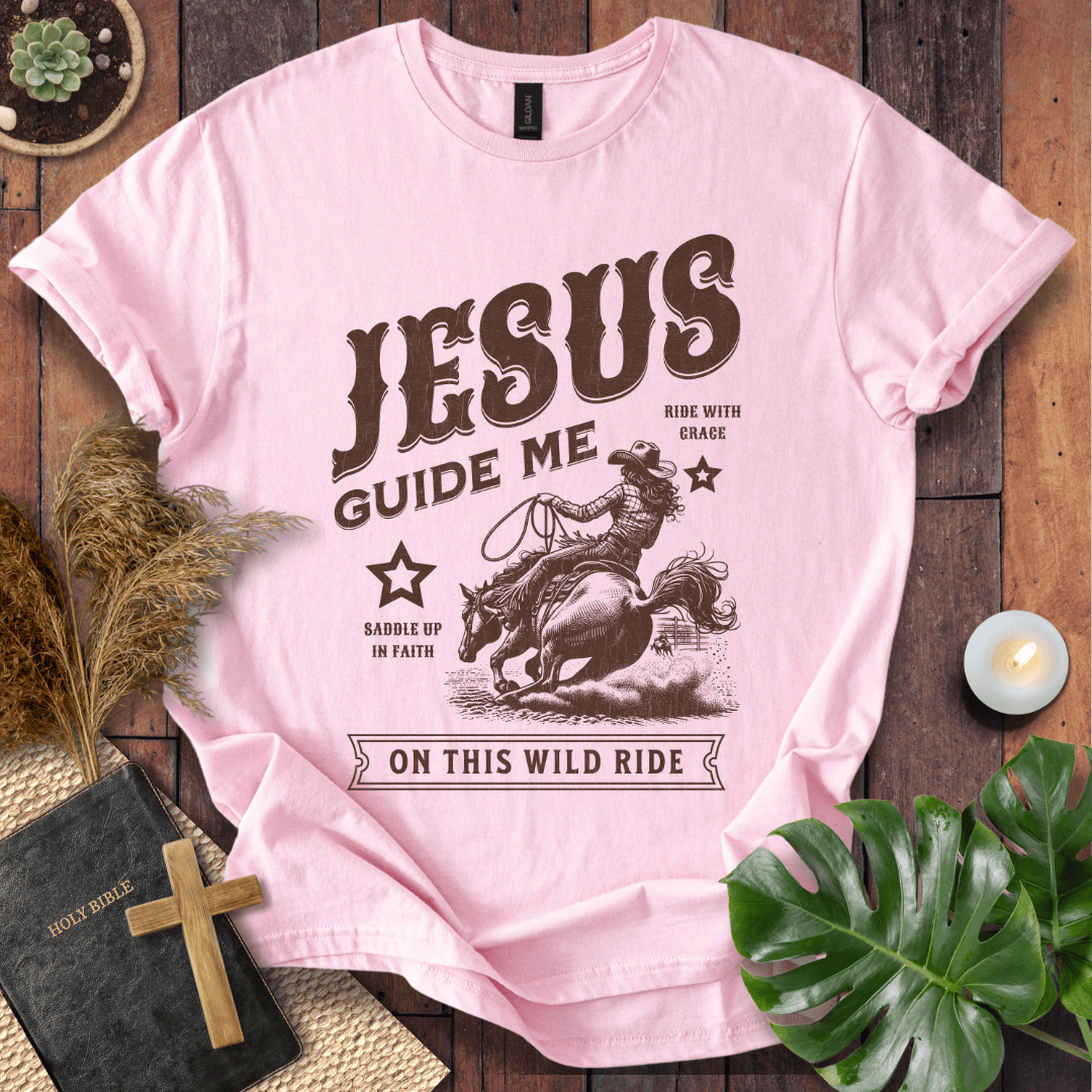 Vintage style t-shirt with a cowgirl riding a horse and text reading Jesus Guide Me On This Wild Ride.