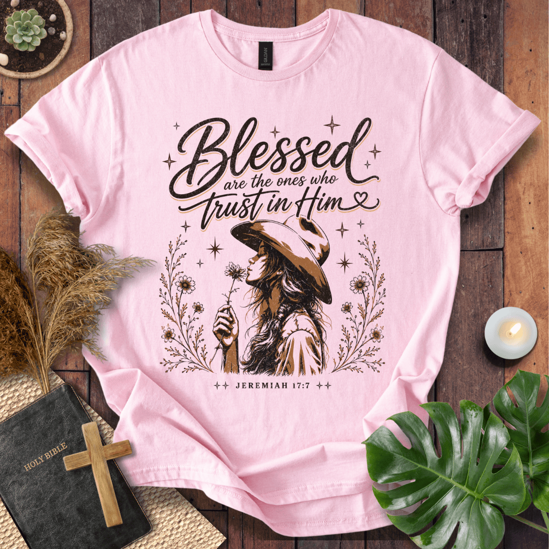 Jeremiah 17:7 sand t-shirt featuring a western woman in a cowboy hat holding a flower with stars and branches.