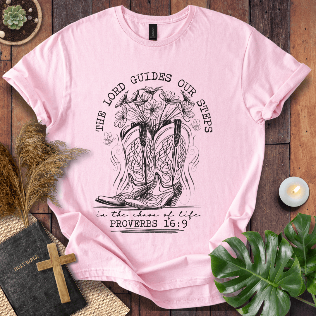 Western cowboy boots with wildflowers and butterflies on shirt with Proverbs 16:9 Bible verse text.
