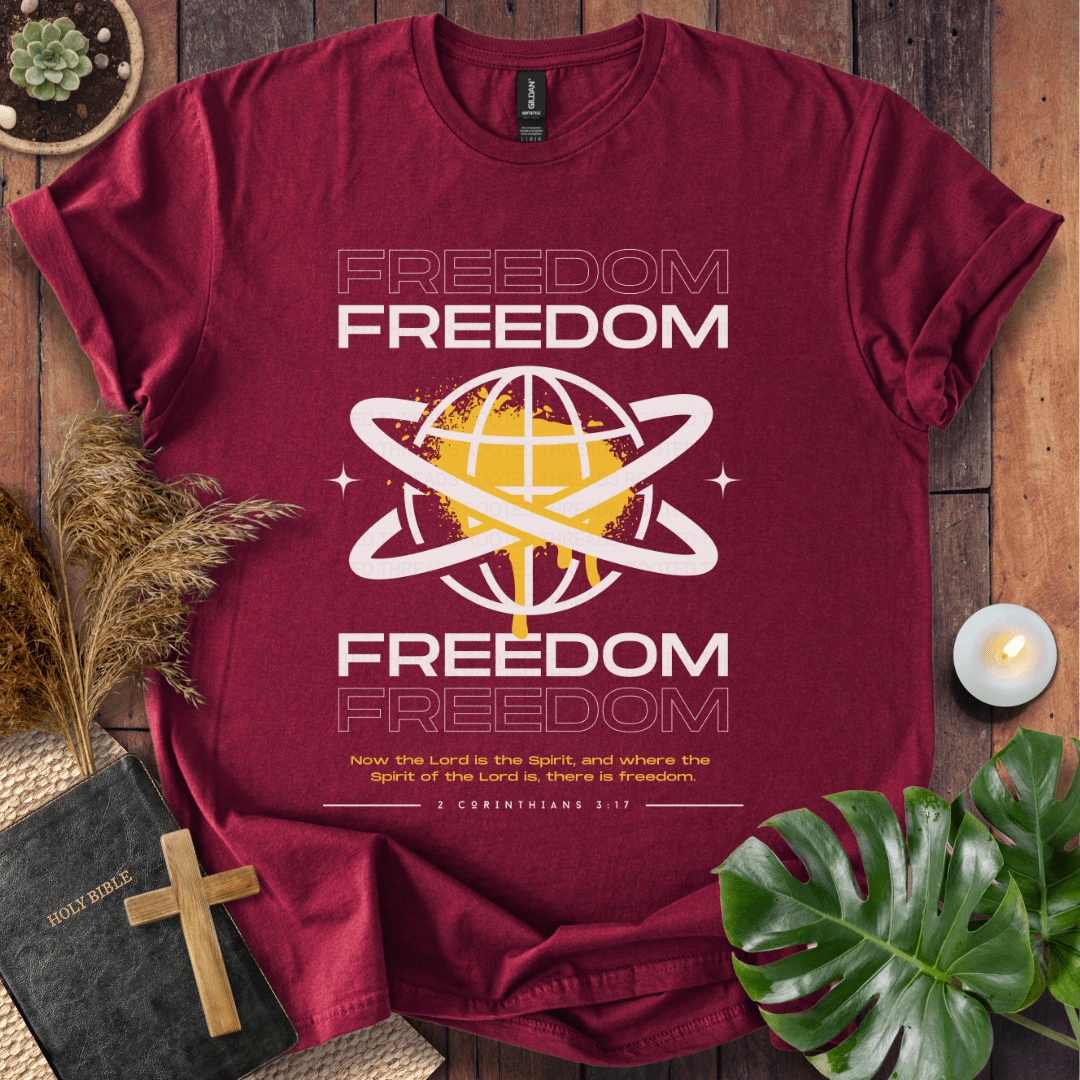Freedom Christian t-shirt—modern globe with orbit rings and verse 2 Corinthians 3:17 about the Spirit and freedom.