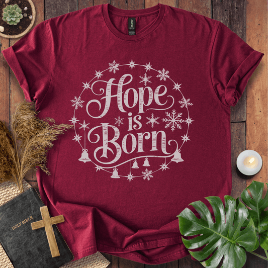 Hope Is Born Christian Christmas t-shirt with festive snowflake design