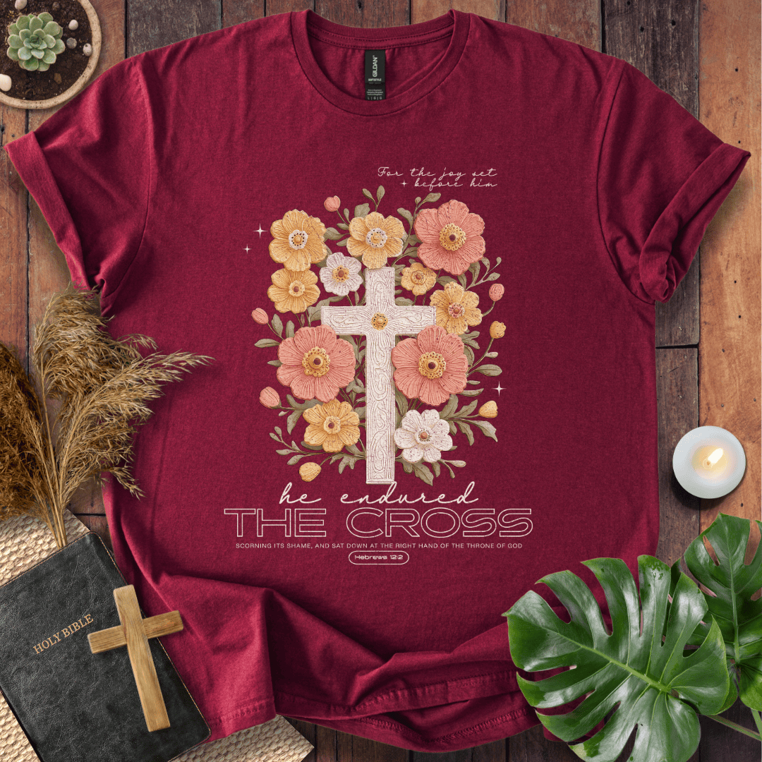 Easter-shirt with a cross and peach flowers featuring Hebrews 12:2 scripture, an essential in women's Christian tees.