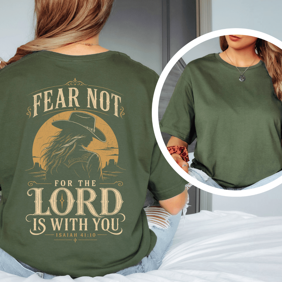 t-shirt showing a cowgirl silhouette in front of a desert sun with the words Fear Not Isaiah 41:10.