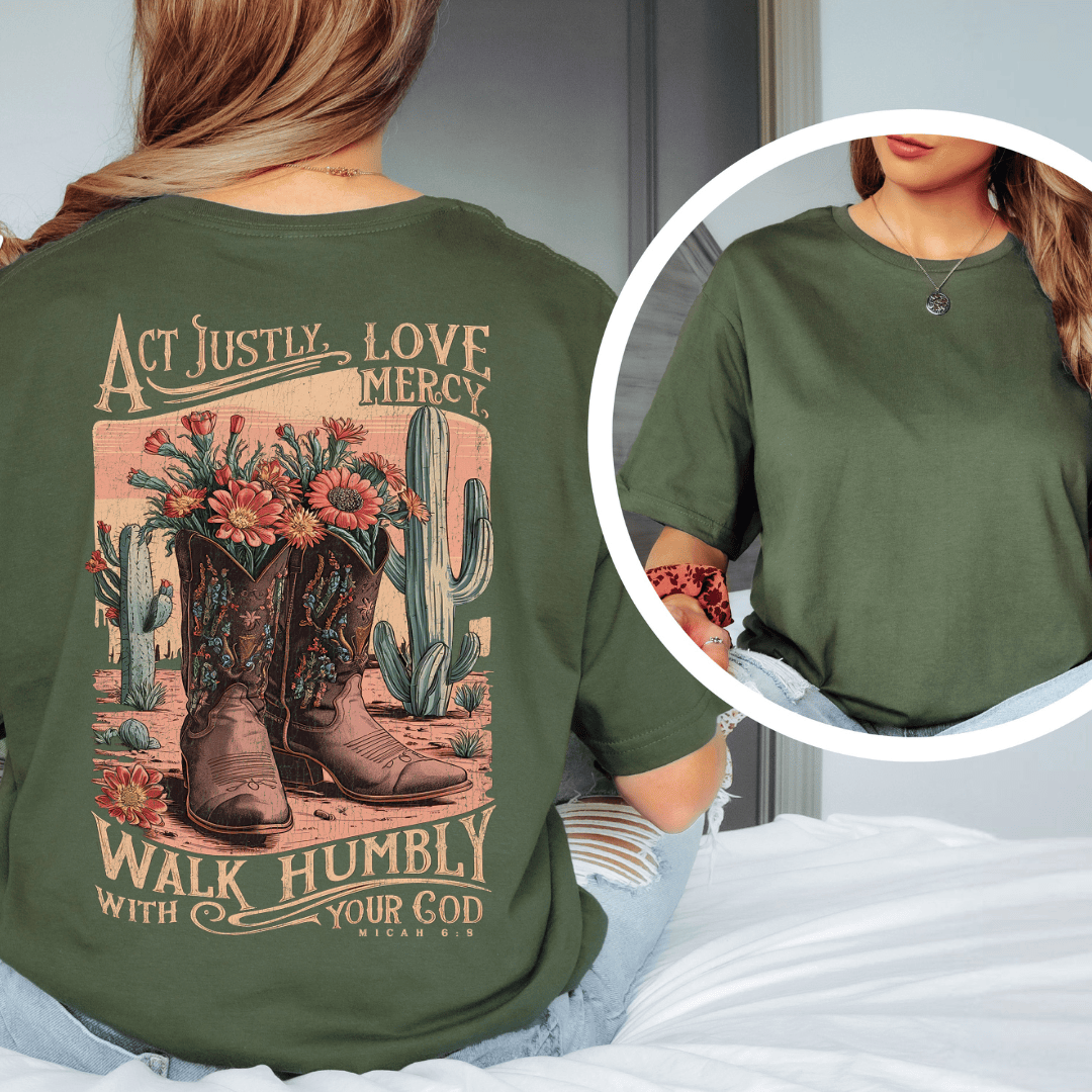 Rear view of a woman wearing Micah 6:8 t-shirt from Black.jpg, featuring western cowboy boots, cacti, and desert wildflowers.