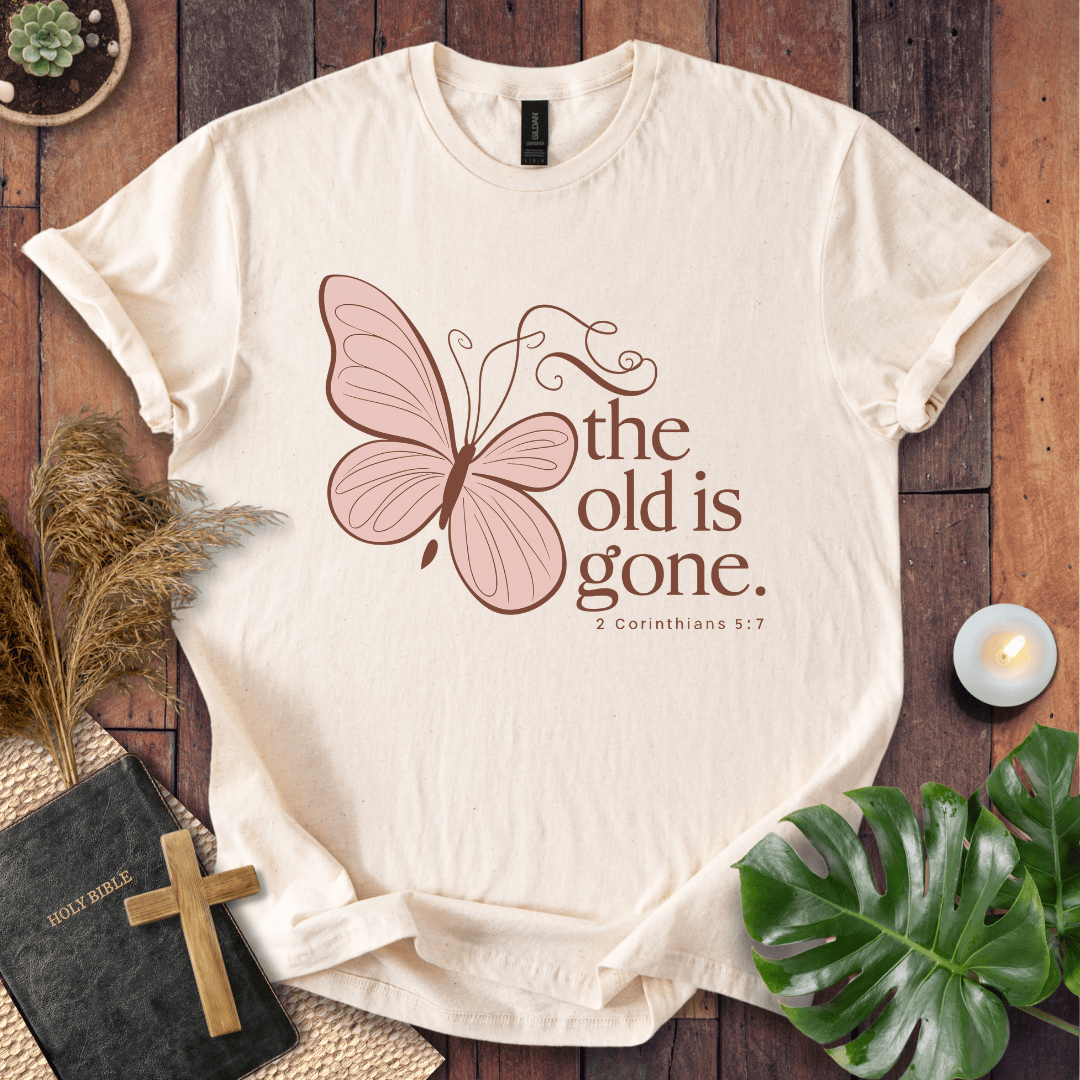 t-shirt with a dusty rose butterfly and "the old is gone" 2 Corinthians 5:17 text in brown ink.
