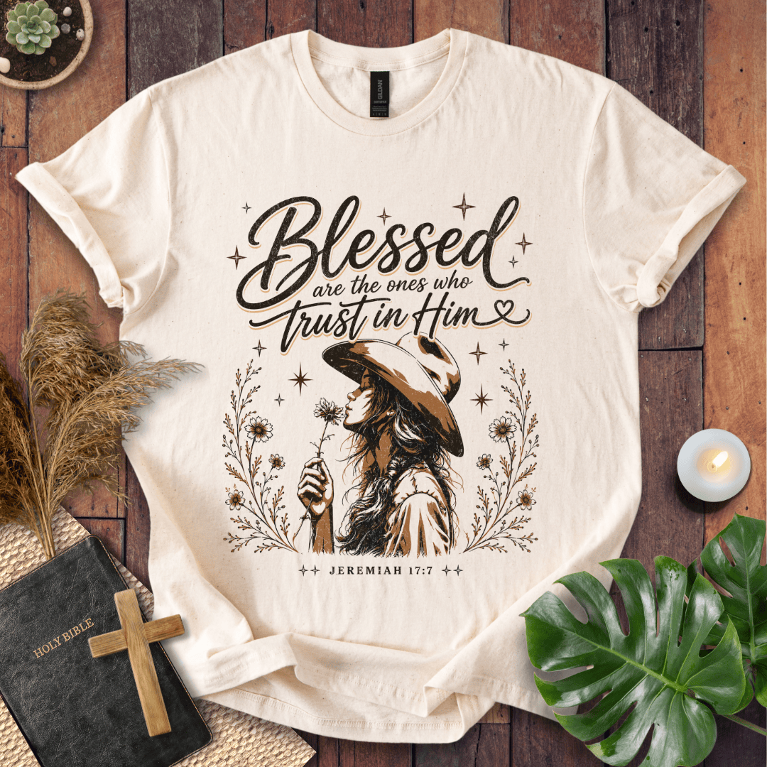 Jeremiah 17:7 sand t-shirt featuring a western woman in a cowboy hat holding a flower with stars and branches.