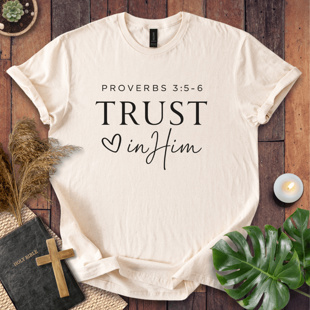 Minimalist Proverbs 3:5-6 Trust in Him shirt for women, a boho style bible verse t shirt on a wooden background.