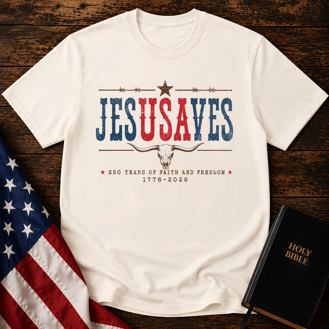 Patriotic sand colored graphic t shirt with Jesus Saves text, a longhorn skull, barbed wire, and American flag.