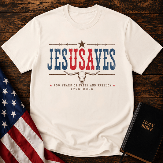 Patriotic sand colored graphic t shirt with Jesus Saves text, a longhorn skull, barbed wire, and American flag.