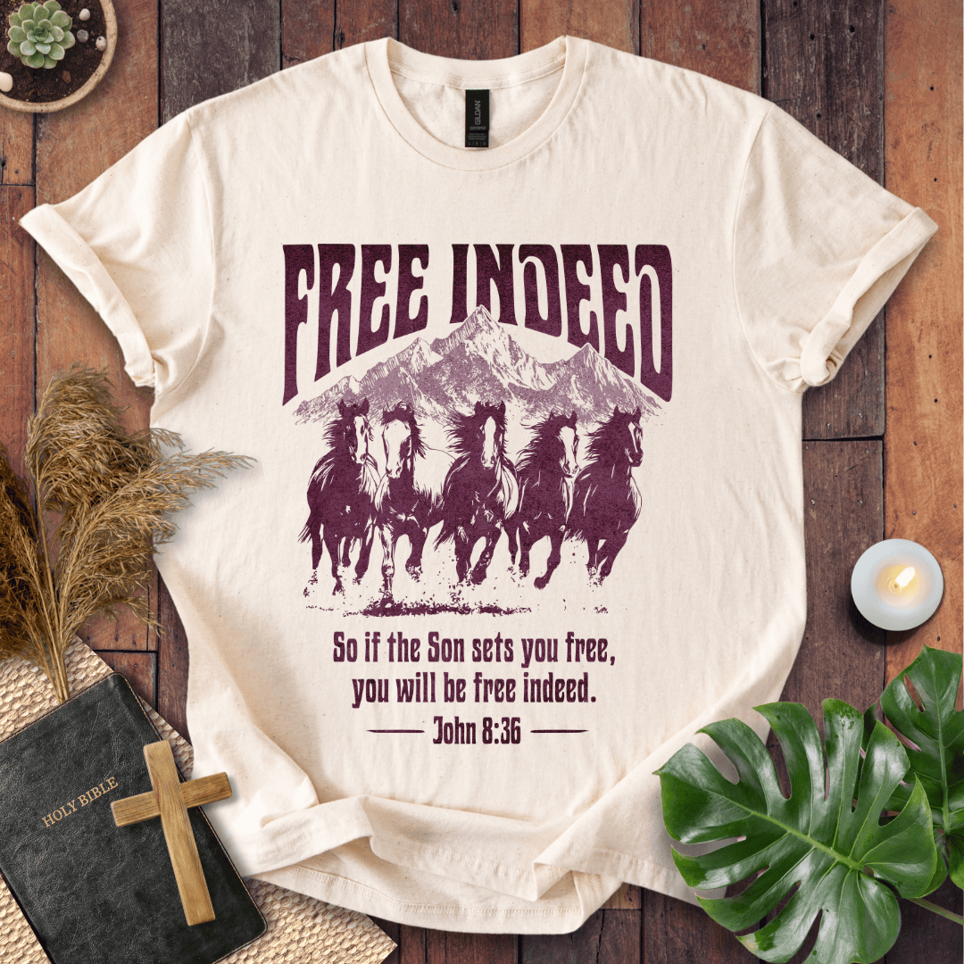 t-shirt featuring five wild horses, mountains, and John 8:36 "Free Indeed" in a vintage distressed print.