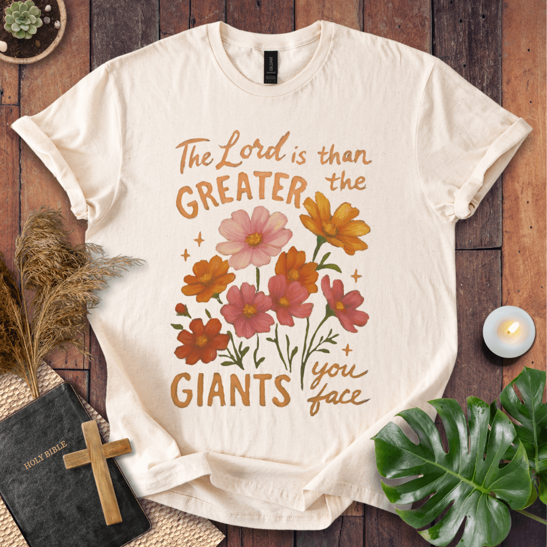 “The Lord is greater than the giants you face” floral lettering Christian t-shirt; uplifting faith tee.