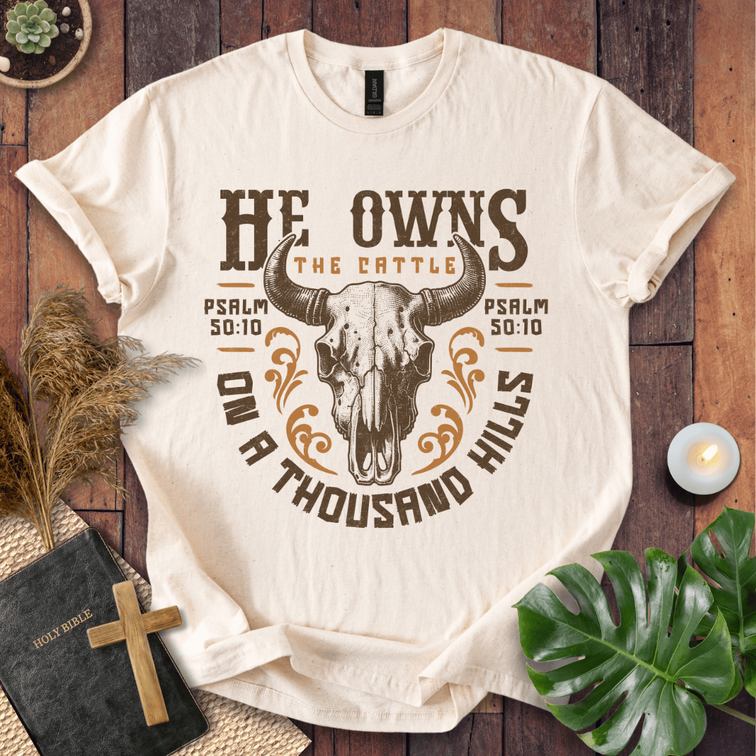 Christian t shirt for women featuring a longhorn skull and Psalm 50:10 He owns the cattle on a thousand hills.