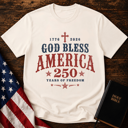 God Bless America 250 Years of Freedom t-shirt next to a Holy Bible and US flag