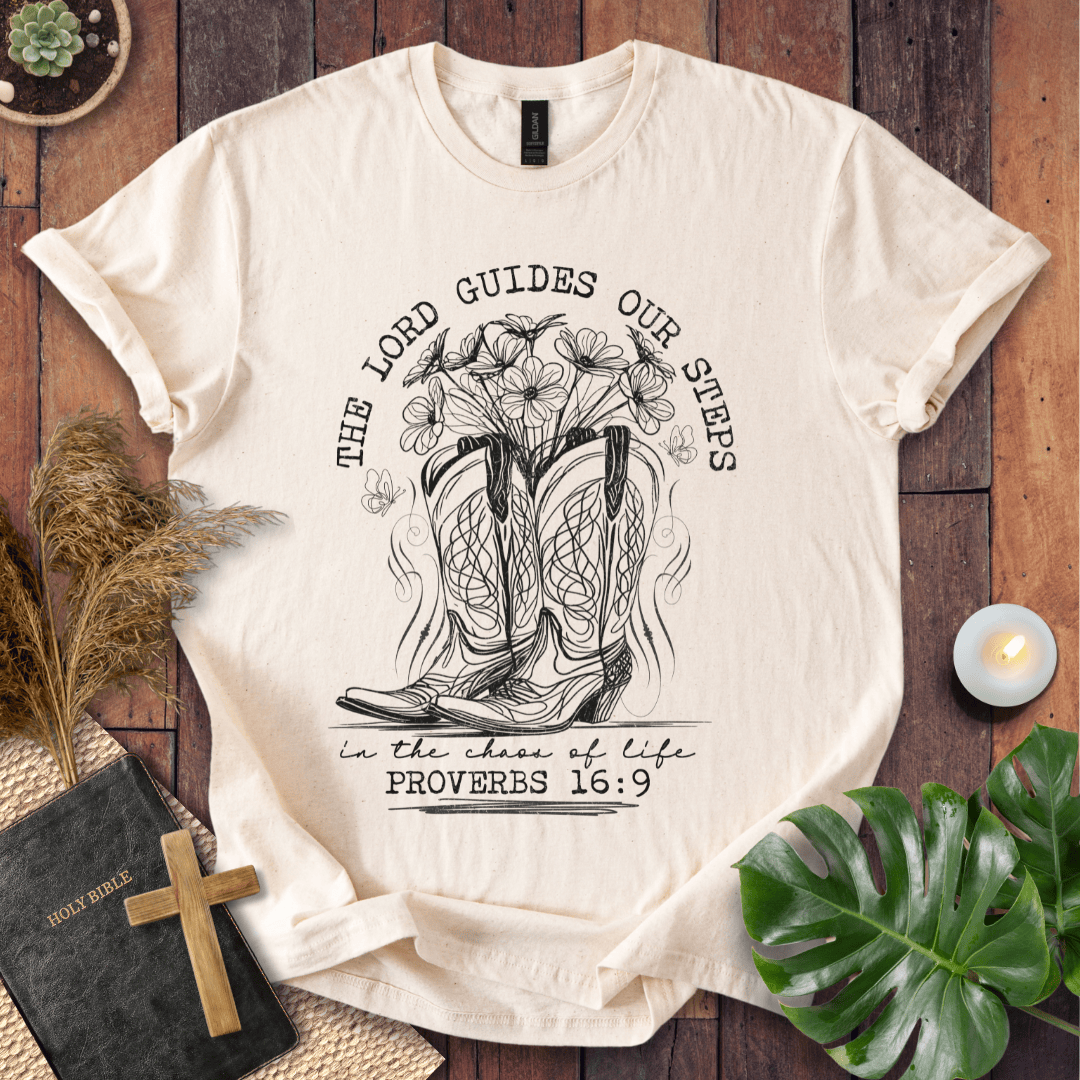 Western cowboy boots with wildflowers and butterflies on shirt with Proverbs 16:9 Bible verse text.