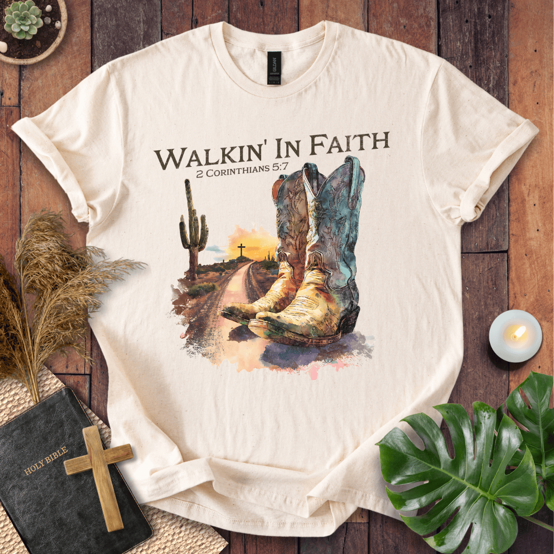 Christian t shirt with watercolor cowboy boots, a desert path, saguaro cactus, and 2 Corinthians 5:7 scripture.