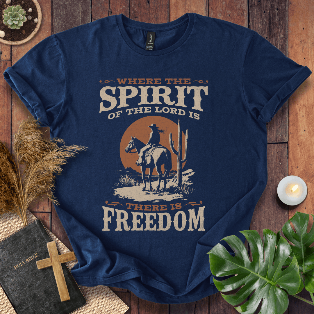 Western t-shirt featuring a horse rider, cactus, and sunset with the bible verse Where the Spirit of the Lord is there is Freedom.