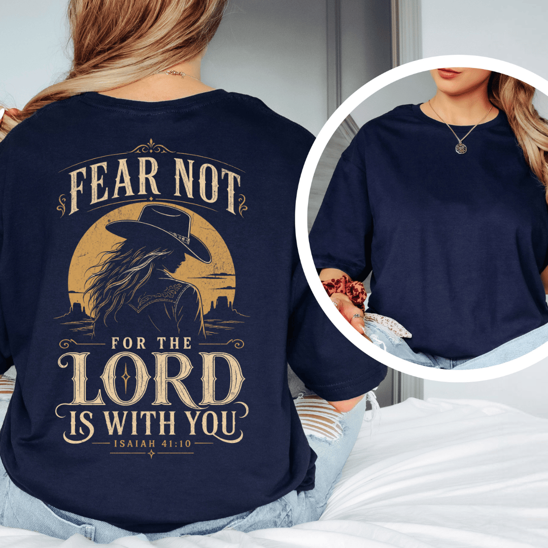 t-shirt showing a cowgirl silhouette in front of a desert sun with the words Fear Not Isaiah 41:10.