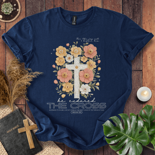 Easter-shirt with a cross and peach flowers featuring Hebrews 12:2 scripture, an essential in women's Christian tees.