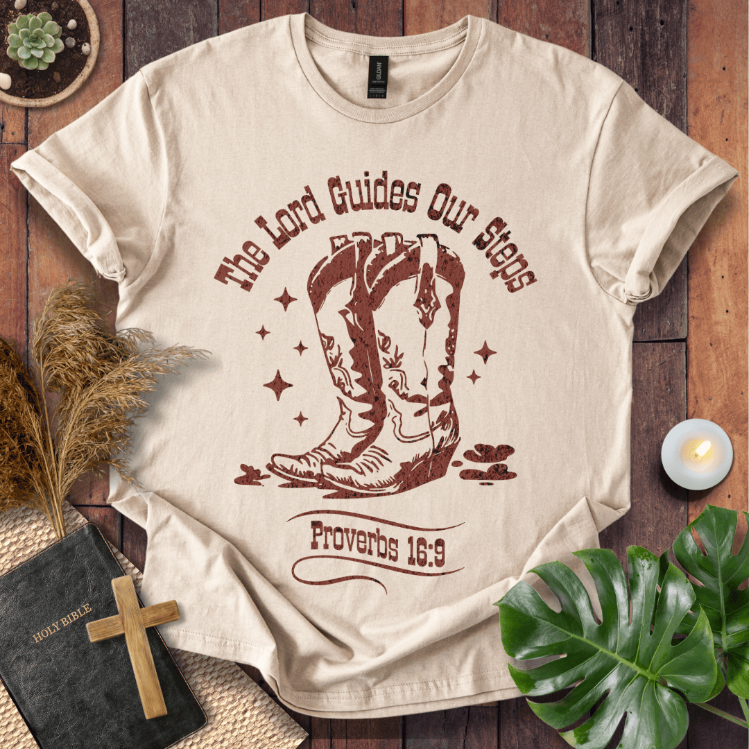 Proverbs 16:9 Christian t shirts for women featuring vintage cowboy boots and "The Lord Guides Our Steps"