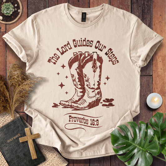 Proverbs 16:9 Christian t shirts for women featuring vintage cowboy boots and "The Lord Guides Our Steps"