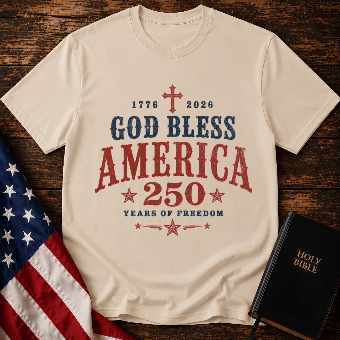 God Bless America 250 Years of Freedom t-shirt next to a Holy Bible and US flag