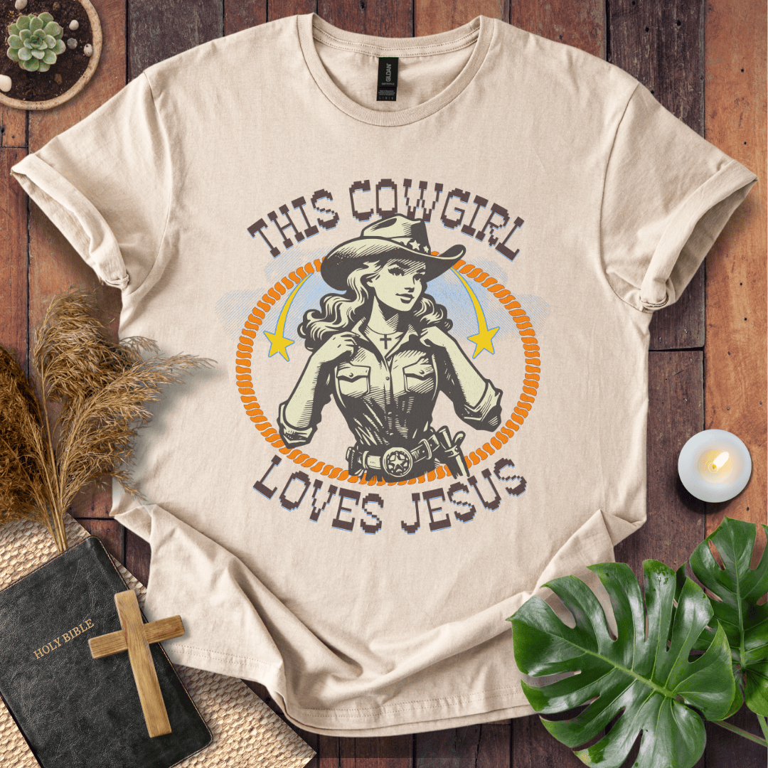 Christian t-shirt featuring a vintage cowgirl illustration with a lasso and the text This Cowgirl Loves Jesus.