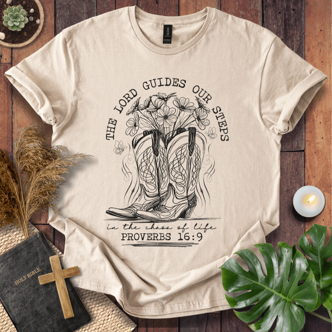 Western cowboy boots with wildflowers and butterflies on shirt with Proverbs 16:9 Bible verse text.