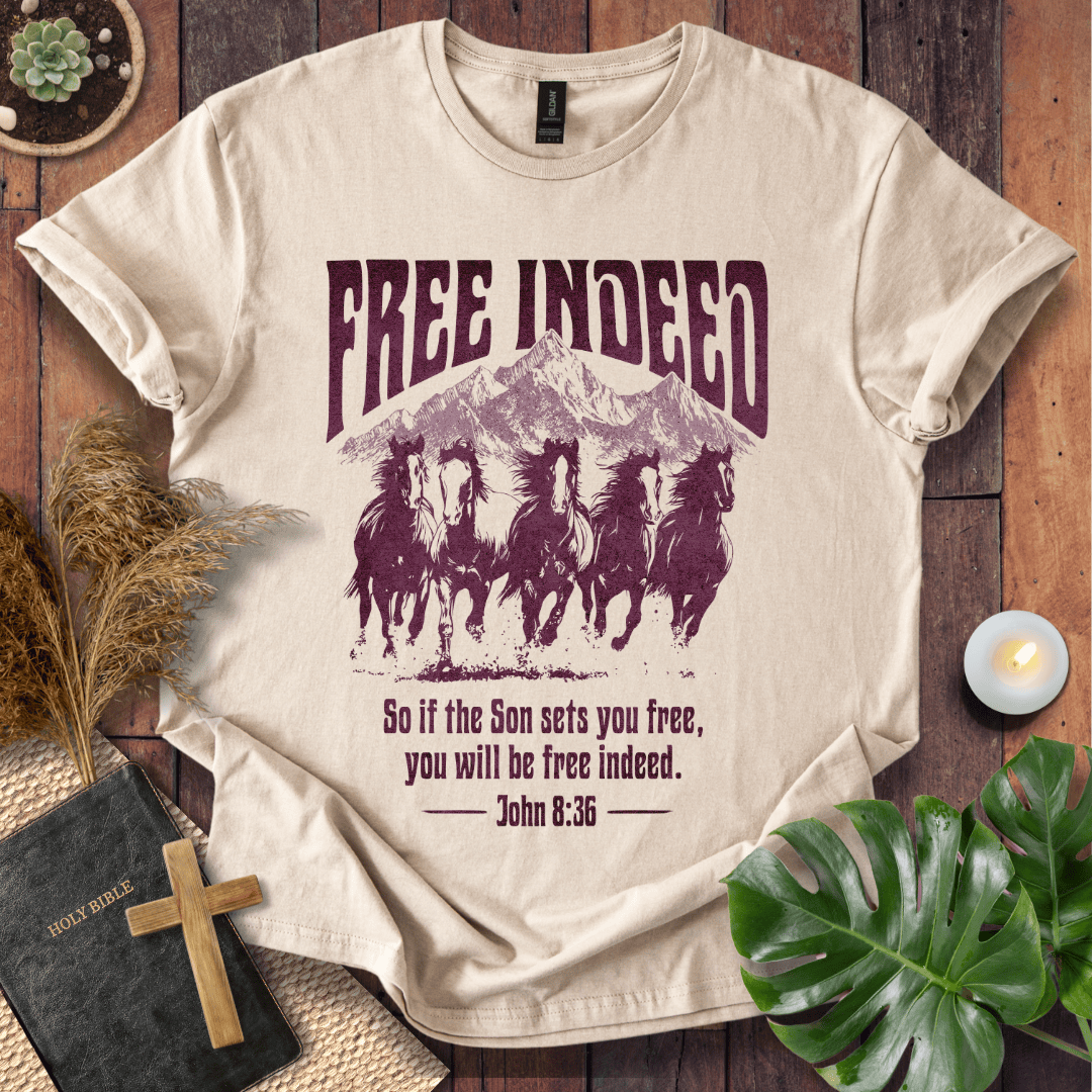 t-shirt featuring five wild horses, mountains, and John 8:36 "Free Indeed" in a vintage distressed print.