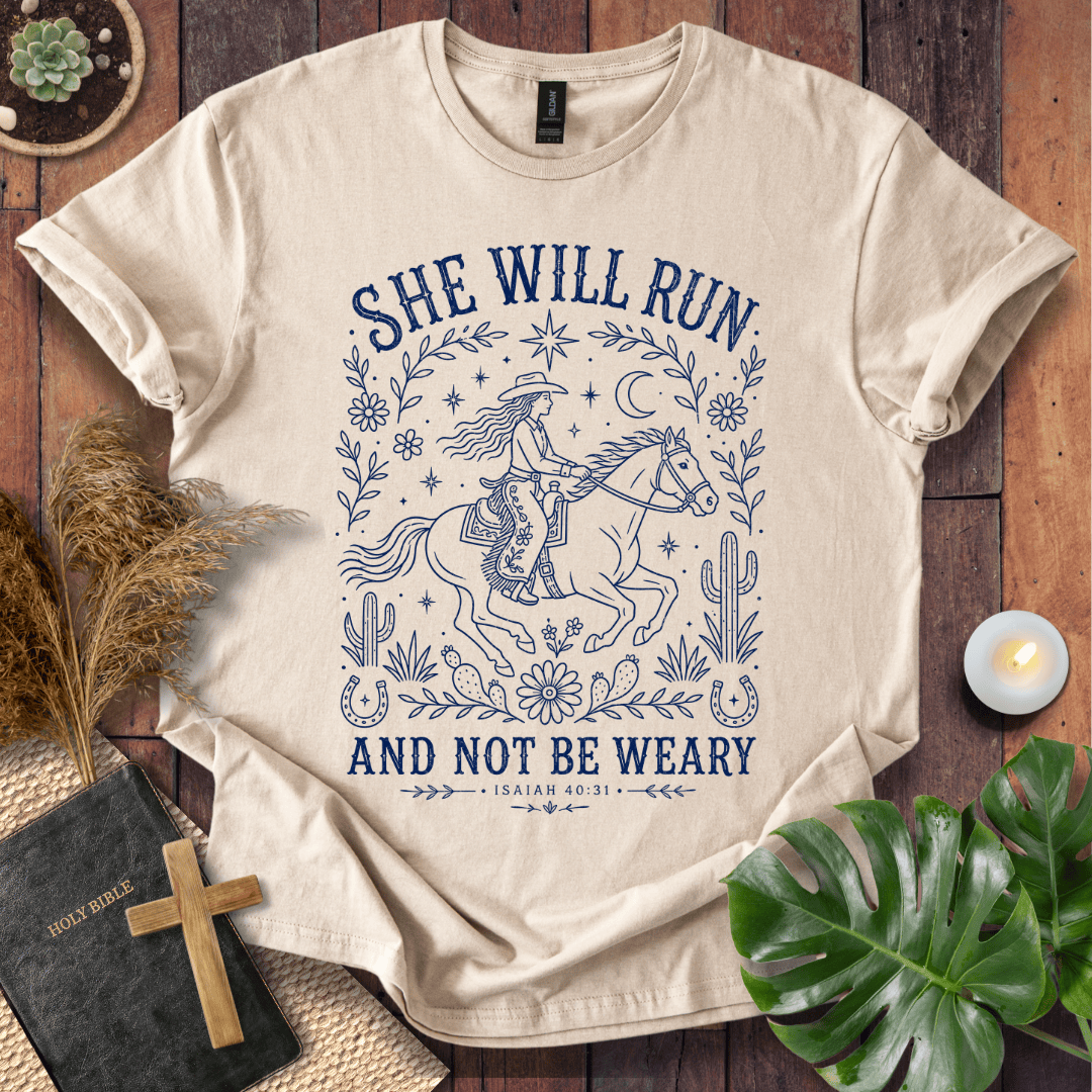 Isaiah 40:31 She Will Run scripture quote on a shirt featuring a navy line art cowgirl riding a horse.