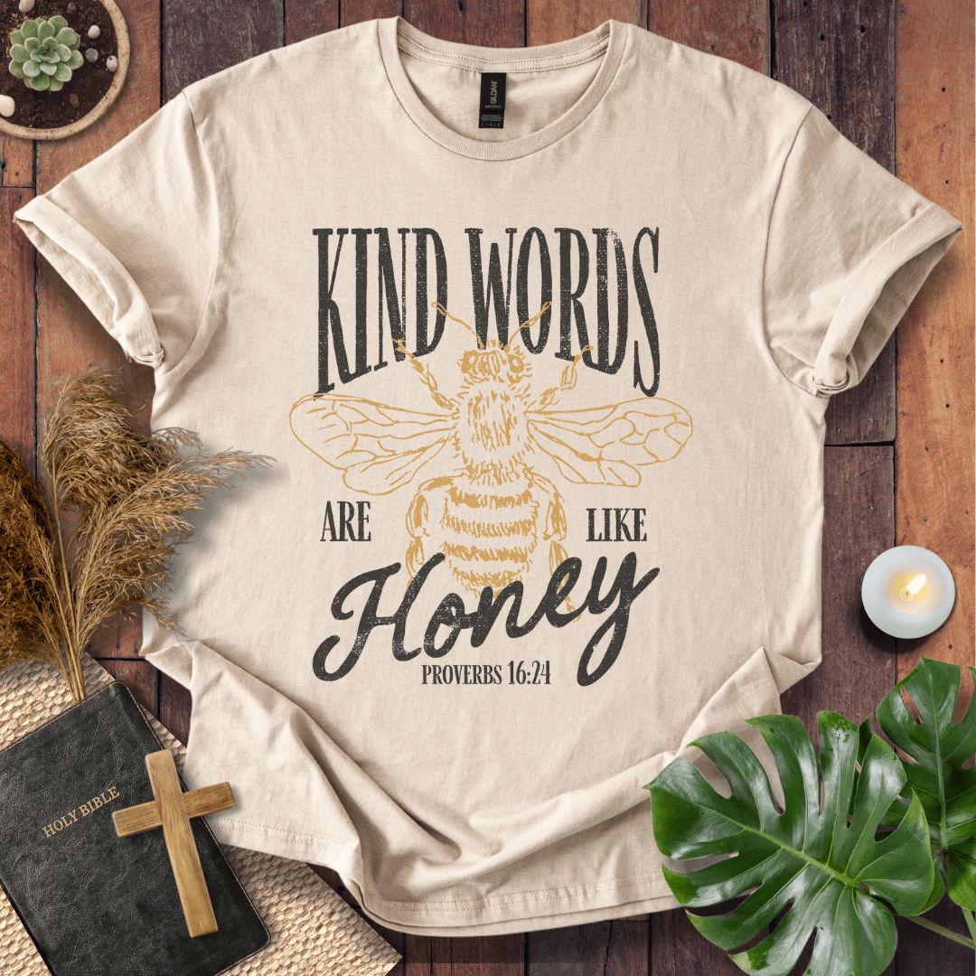 Proverbs 16:24 "Kind Words Are Like Honey" t-shirt featuring a vintage gold honeybee graphic and rustic text.