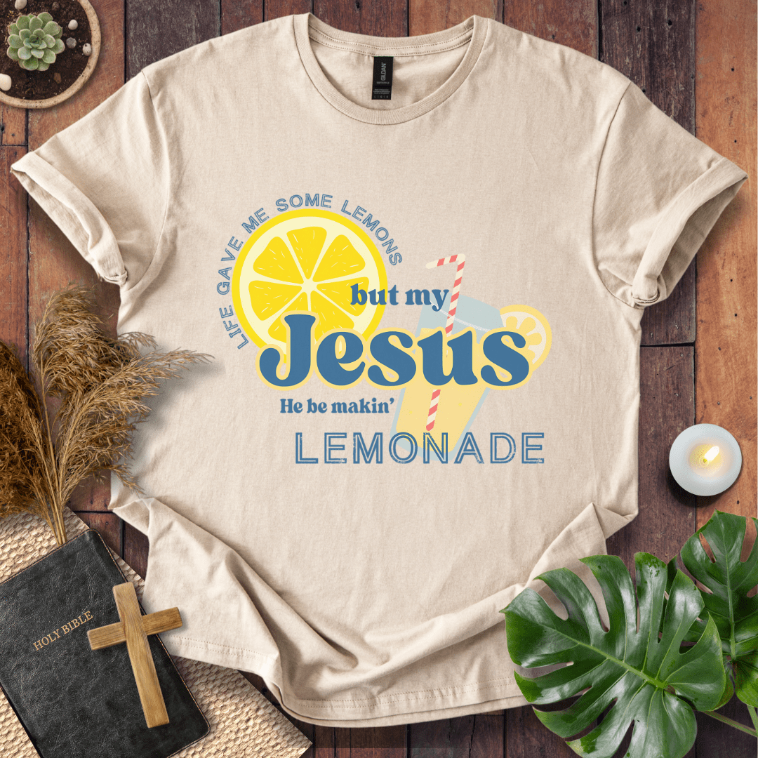 “Life gave me lemons but my Jesus makes lemonade” Christian t-shirt with bold lemon and straw graphic; playful faith tee.